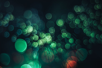 Poster - Beautiful abstract optical fiber green cold bokeh in the darkness background.