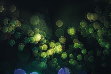 Poster - Beautiful abstract optical fiber green cold bokeh in the darkness background.