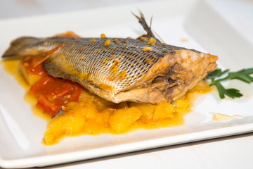 Wall Mural - stewed fish dish with potatoes and peppers