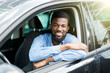 © F8  \ Suport Ukraine - Closeup portrait happy smiling young african man sitting in his new car excited ready for trip