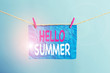 Writing note showing Hello Summer. Business concept for Welcoming the warmest season of the year comes after spring Clothesline clothespin rectangle shaped paper reminder white wood desk