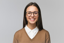Beautiful Smiling Female College Teacher Wearing Trendy Glasses, Isolated On Gray Background