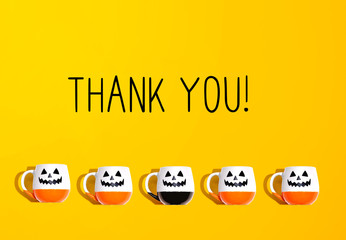 Wall Mural - Thank you message with Halloween ghost mugs - flat lay