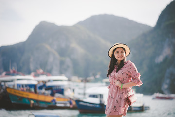 Portrait Asian beautiful woman Have fun with the sea. On her holiday on Phi Phi Island, Krabi Province, Thailand