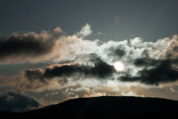 Wall Mural - dark clouds covering the sun pollution global warming