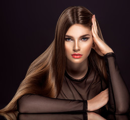 Woman with beauty long brown hair. Beauty woman with living coral color lipstick on lips.