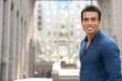 © New Africa - Portrait of handsome young African-American man on city street. Space for text