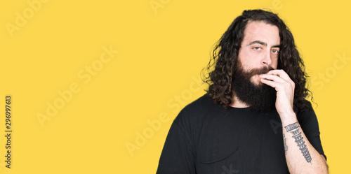 Young Man With Long Hair And Beard Wearing Heavy Metal Black