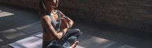 Calm Fit Sporty Healthy Mindful Woman Sit In Lotus Pose Doing Yoga Exercise Breathing Fresh Air Meditating In Gym Lit With Sunlight, Stress Free Concept, Horizontal Banner Website Design, Copy Space