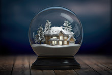Glass Snow Globe And A House With Lights In Windows In The Night.