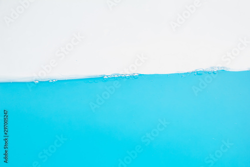 Water splash. Aqua flowing in waves and bubbles . on white background. © PuripattCome