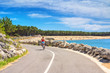Coastal landscape - view of the Atlantic coast with a woman cyclist near the town of La Palmyre, the Nouvelle-Aquitaine region, in the south-west of France