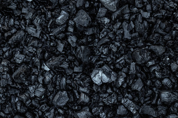 Dark coal texture, coal mining, fossil fuels, environmental pollution.