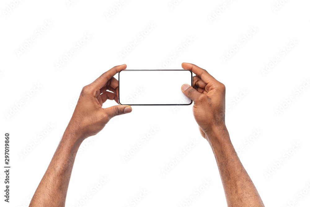 Black male hands taking photo on smartphone with blank screen - obrazy, fototapety, plakaty 