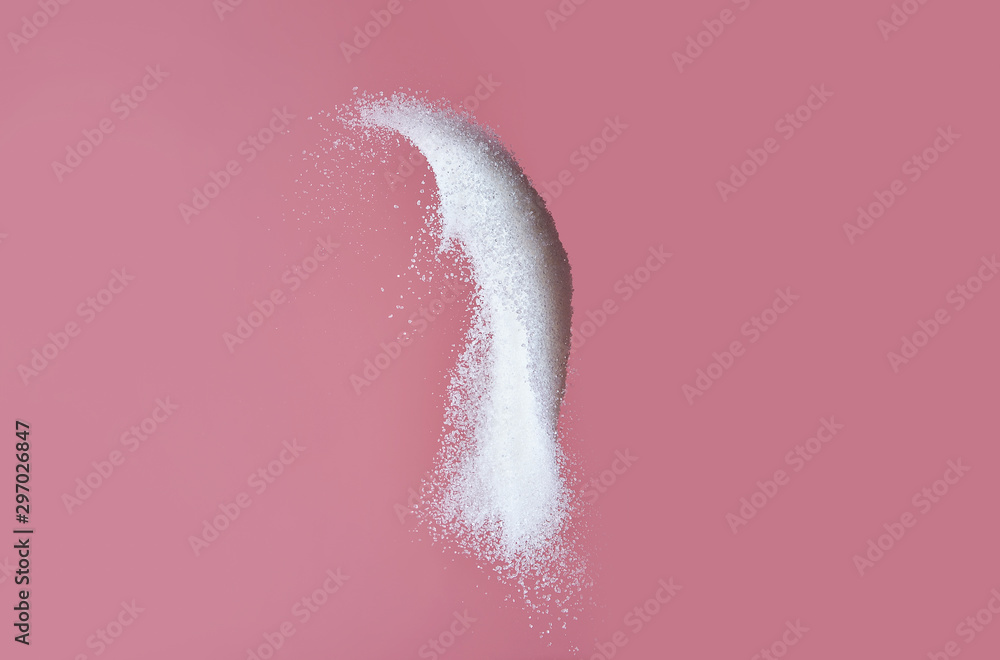 Throwing of sand sugar against color background - obrazy, fototapety, plakaty 