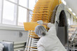 confectioner-technologist checks the quality of wafers on the conveyor