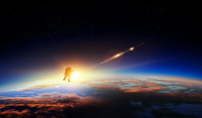 Wall Mural - spaceman and planet, human in space concept