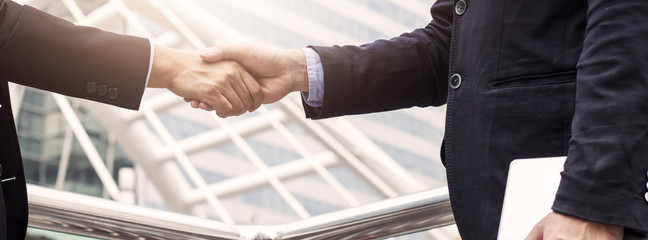 Success business, successful agreement negotiation and confident  partner cooperation concept, Businessman shake hands with customer in banner background