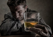 © TheVisualsYouNeed - alcoholic depressed and drunk addict man sitting in front of whiskey glass trying holding on drinking in dramatic expression suffering alcoholism and alcohol addiction