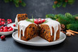 Traditional Christmas fruit cake, pudding with dried fruits, nuts and white glaze.