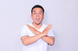© Hermansyah - angry asian young man expression while crossed his hand