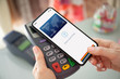 © DenPhoto - phone face scanning id payment purchase on paypass online terminal