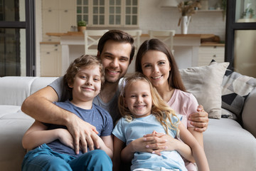 Wall Mural - Head shot portrait happy family with two kids at home