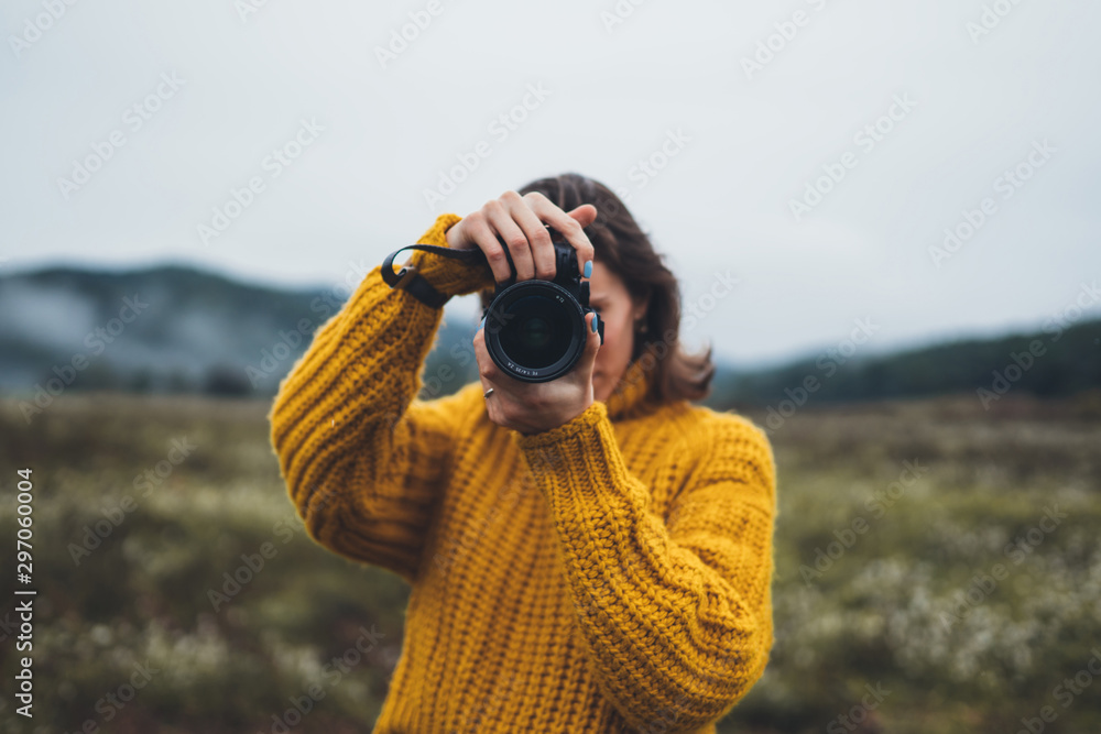 photographer tourist take photo on camera lens on background autumn foggy mountain, traveler hipster shooting video nature mist landscape, hobby vacation concept, copy space - obrazy, fototapety, plakaty 