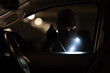 © torwaiphoto - The robbers robbed the car in the parking lot at night.