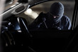 © torwaiphoto - The robbers robbed the car in the parking lot at night.