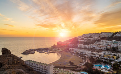 Amazing landscape with sunset at Puerto Rico village and beach on Gran Canaria, Spain