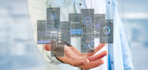 Wall Mural - businessman holding user interface screens with icon, stats and data 3d rendering