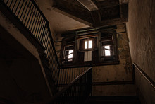 Wooden Stair Case In Boarded Up, Dilapidated House