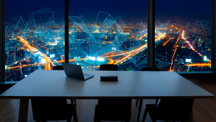 Fototapete - Meeting room and Workplace with notebook laptop Comfortable work table in office windows and Bangkok city view with network concept.