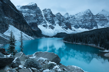Wall Mural - first snow morning at moraine lake in banff national park alberta canada snow-covered winter mountai