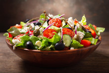 Bowl Of Fresh Salad With Vegetables, Feta Cheese And Capers
