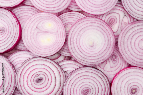 Fotomural Onion slices as a background. Top view.