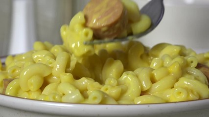 Sticker - Eating a forkful of macaroni and cheese close up