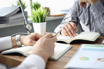 Hand of businessman in suit filling