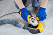 © Kadmy - concrete floor surface grinding by angle grinder machine