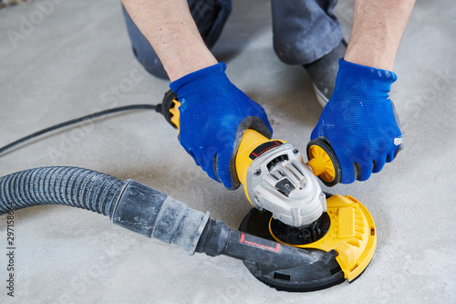 Photographie concrete floor surface grinding by angle grinder machine