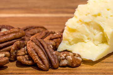 Close shot of pecan nuts and cheddar cheese a classic keto or low carb snack