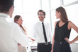 © ASDF - smiling businessman welcomes his partner with a handshake