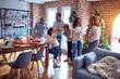 © Krakenimages.com - Family and friends dining at home celebrating christmas eve with traditional food and decoration, chatting all together