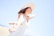 © Krakenimages.com - Young beautiful woman sunbathing with open arms enjoying summer vacation at maspalomas dunes beach