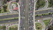 Aerial Top View Of Traffic Jam Over A Road Junction. Drone Slowly Ascending