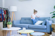 © Krakenimages.com - Beautiful toddler child girl jumping on the sofa