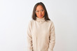 © Krakenimages.com - Young chinese woman wearing turtleneck sweater and glasses over isolated white background depressed and worry for distress, crying angry and afraid. Sad expression.