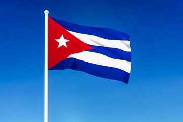 Wall Mural - Waving flag of Cuba on the blue sky background
