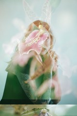 portrait of a woman double exposed with flowers